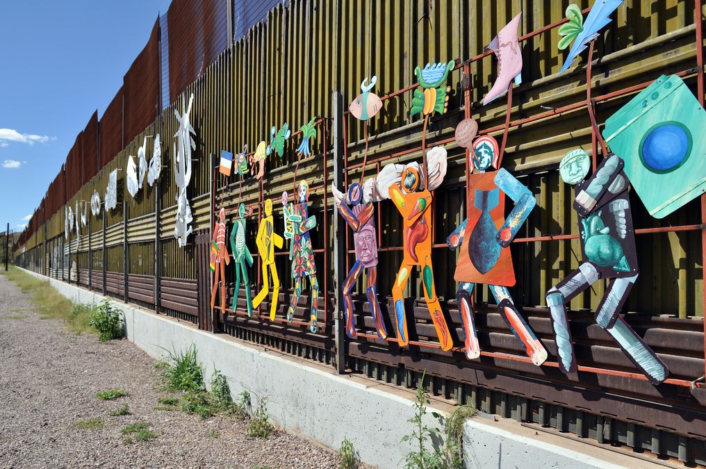 enlarge the image: Mural "Paseo de Humanidad" (Parade of Humanity) by artists Alberto Morackis, Alfred Quiróz, and Guadalupe Serrano on the Mexican side of the US border, Image Credit: Jonathan McIntosh, Wikimedia Commons